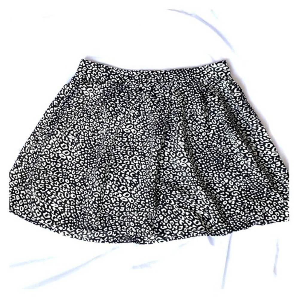 Above the knee black and white skirt